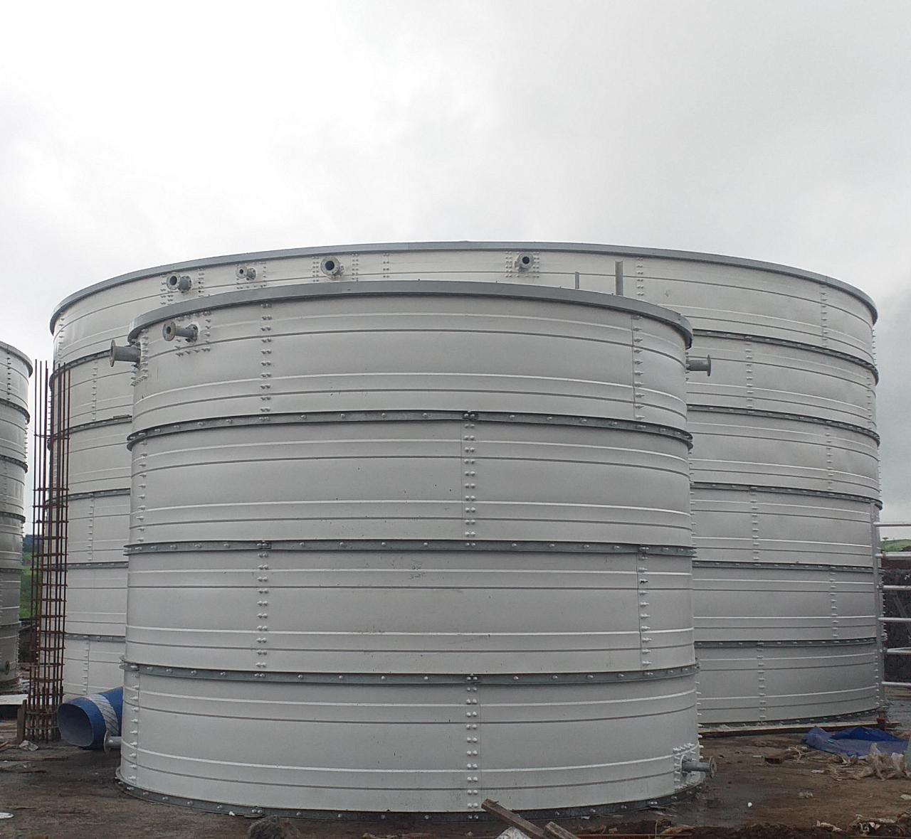 White Zinc Aluminium Steel tank in the foreground with larger tanks behind it
