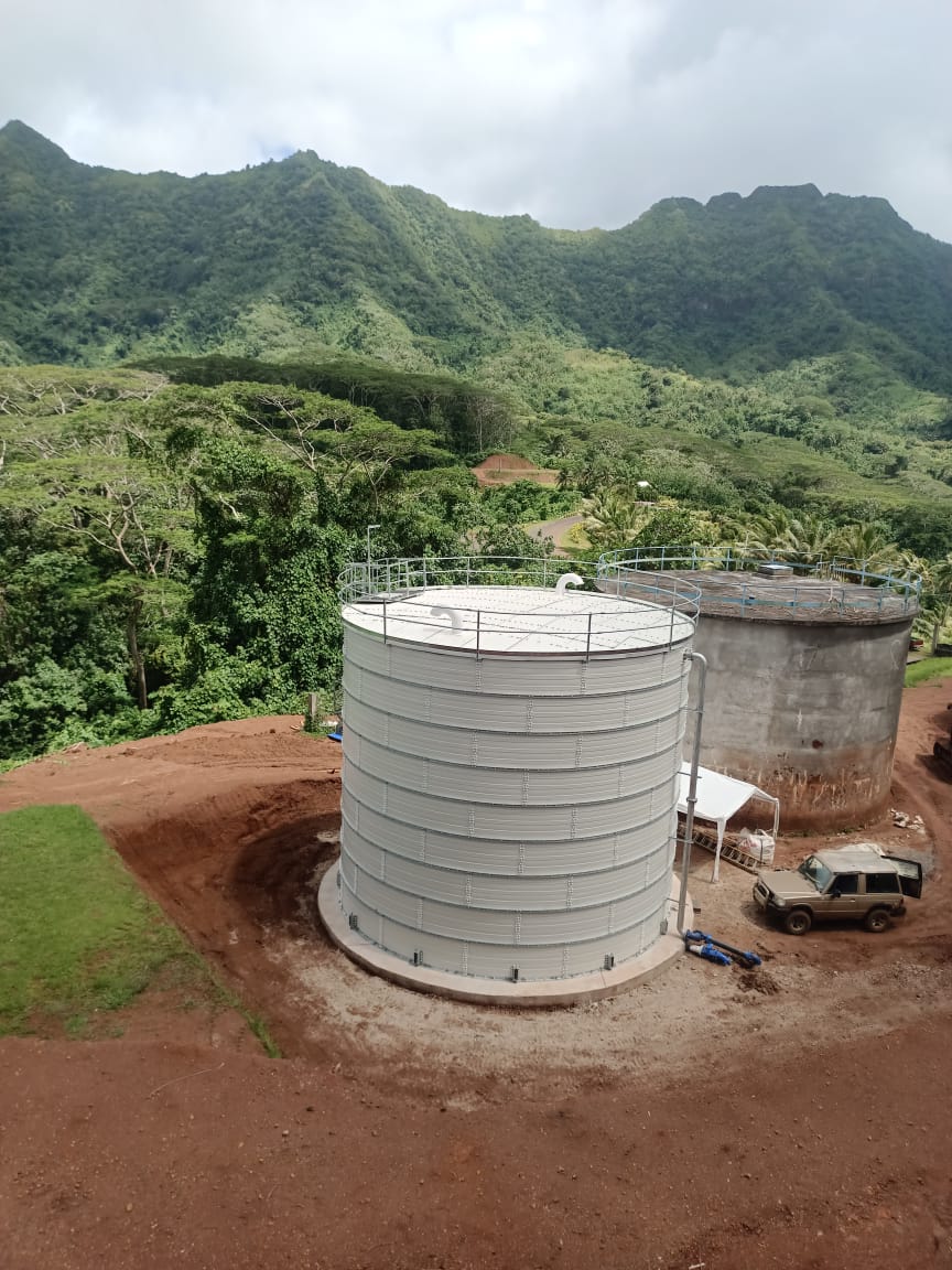 White Zinc Aluminium Steel tank with roof installed in a plantation setting