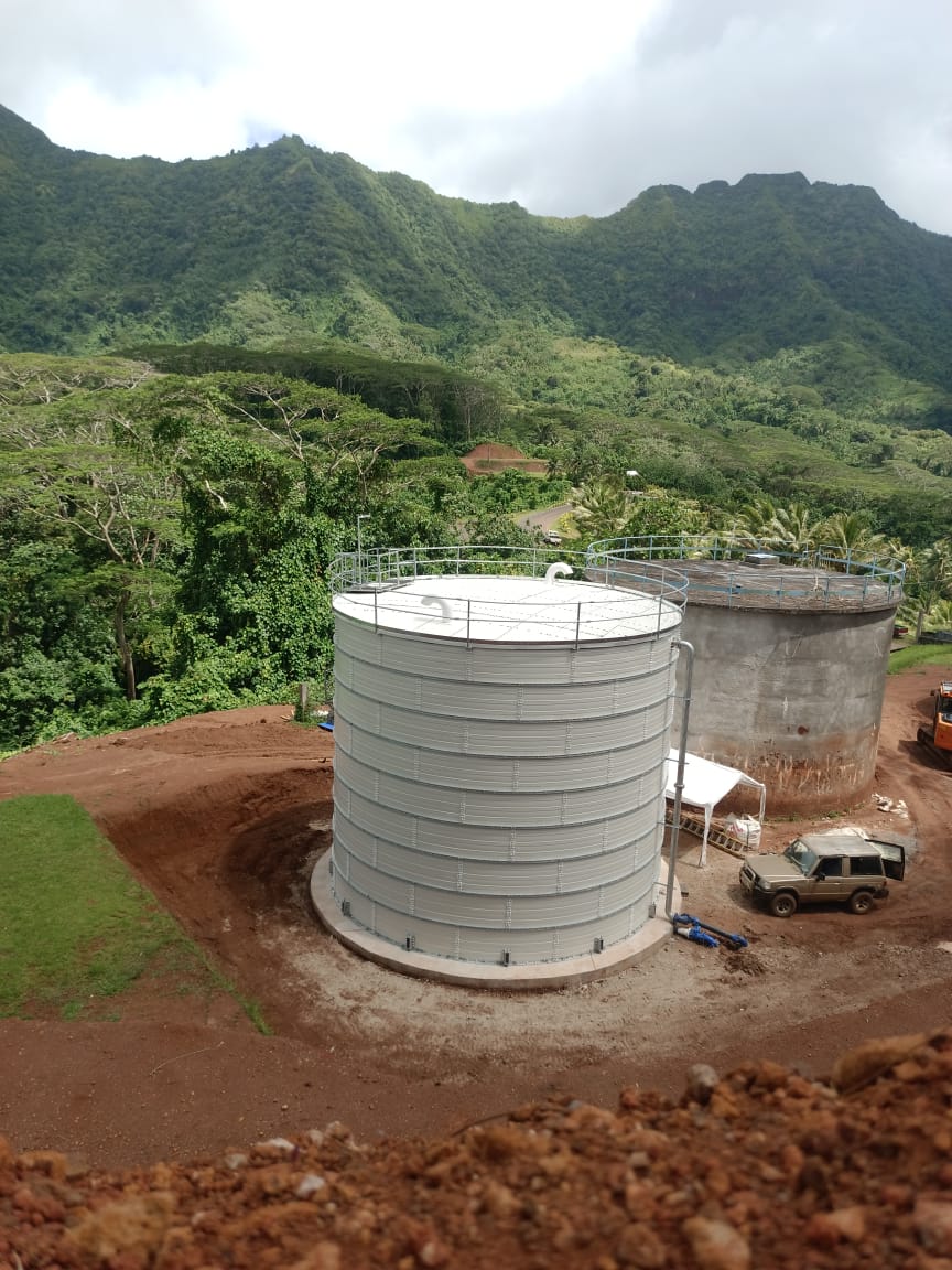 White Zinc Aluminium Steel tank with ladder and level indicator at a plant site
