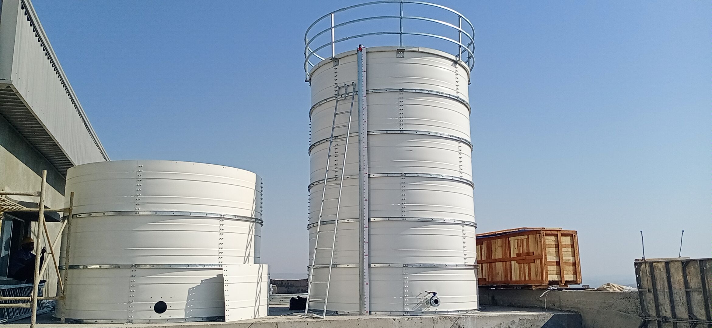 White Zinc Aluminium Steel tank installed on an open industrial site