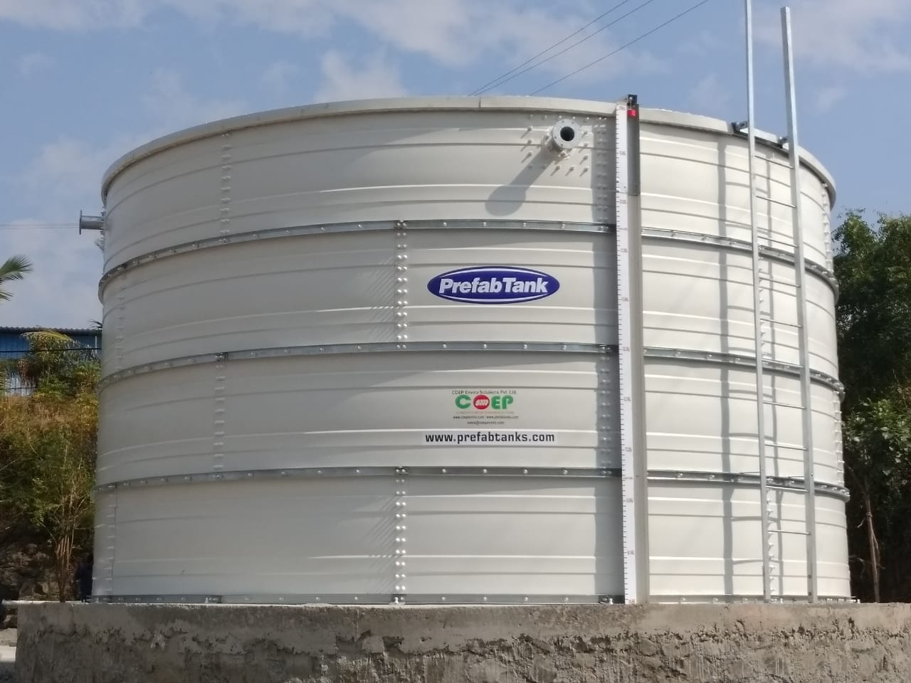 White Zinc Aluminium Steel tank with clear sky backdrop at a project site