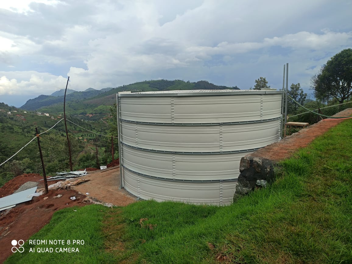 White Zinc Aluminium Steel storage tank on prepared soil foundation